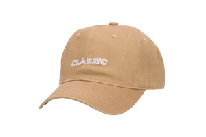 Detailed close-up of white CLASSIC embroidery on khaki cotton twill baseball cap