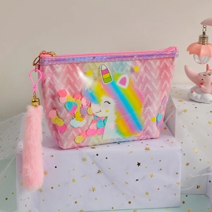Detail of pink unicorn makeup bag featuring colorful sequins and a fuzzy pom-pom zipper pull