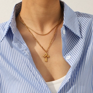 Double-layered stainless steel cross necklace with a brown gemstone on a gold finish