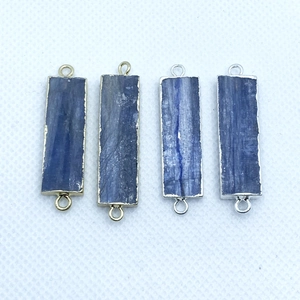 Detail of natural kyanite connectors in gold and silver plating with double hanging loops