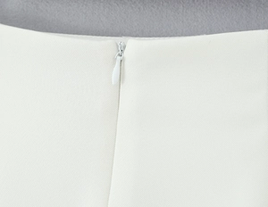 Detailed macro view of high-quality white lace fabric texture and seamless invisible zipper
