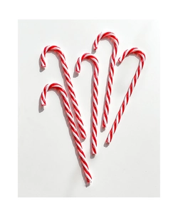 Set of four red and white striped Christmas candy cane ornaments on a white background