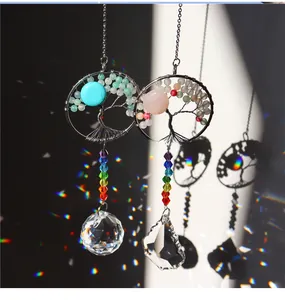 Macro detail of Tree of Life crystal suncatcher with rainbow prisms and light-catching beads