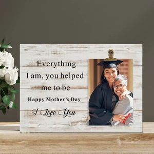 Detail of wooden Mother's Day photo frame with metal clip and white roses decor
