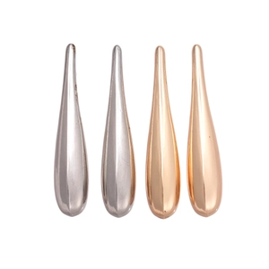 Polished teardrop earrings in silver and rose gold finish with minimalist metallic glow