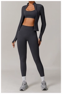 Detailed view of high-waisted seamless gray fitness set with jacket, bra and yoga leggings