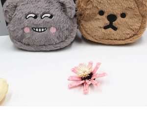 Detailed view of grey and brown plush bear coin purses with cute embroidered facial features