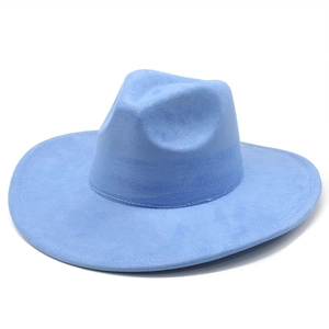 Detail shot of sky blue suede wide brim fedora hat with smooth texture on white background