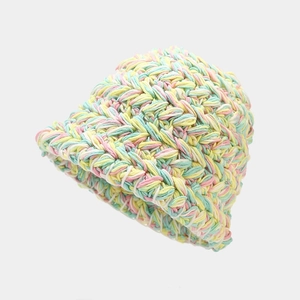 Detailed view of colorful chunky knit bucket hat with vibrant handmade texture and colors