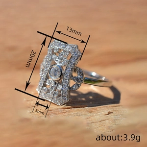 Elegant hollow silver ring with sparkling diamonds and vintage rectangular design