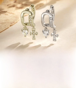 Detail of coffee gold and silver cross heart earrings with 1.0mm thickness and 10mm inner diameter