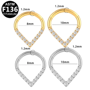 G23 titanium teardrop piercing rings in gold and silver finish with zircon inlays