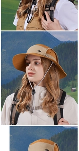Detail of waterproof hiking sun hat with wide brim, windproof rope and mountain logo