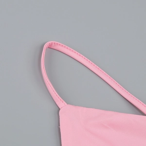 Detail of pink dress thin shoulder straps featuring high-quality twill weave fabric texture