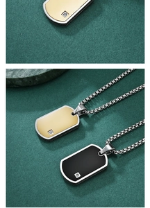 Close-up of military dog tags with matte finish, polished edges and crystal insets