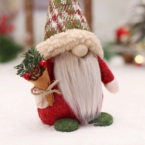 Nordic Christmas gnome doll with red felt body, knitted hat and small pine cone berries