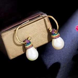 Close-up of rainbow zircon earrings with S925 needles and white teardrop pearls