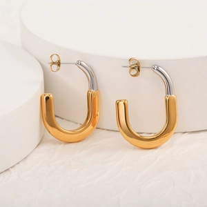 U-shaped earrings with two-tone gold and silver stainless steel finish on a white background