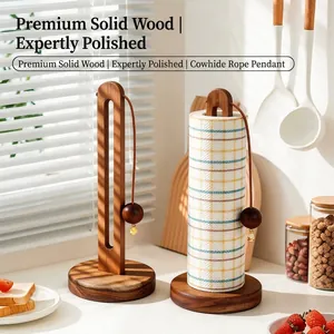 Vertical solid wood paper towel holder with weighted base and leather cord in kitchen