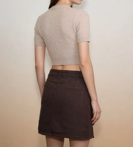 Detail view of denim mini skirt back with high waist design and dual rear pockets