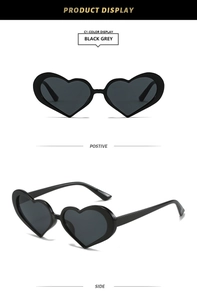 Front and side view of chic heart-shaped sunglasses with black frames and grey lenses