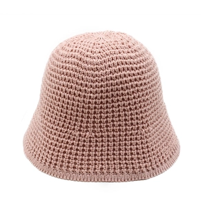 Detailed close-up of hollow knit texture on a mauve sun hat showing breathable stitching