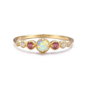 Elegant gold S925 sterling silver opal ring with pink sapphires on a white background