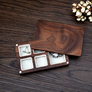 Portable walnut wood jewelry box with cream velvet lining for rings and necklaces