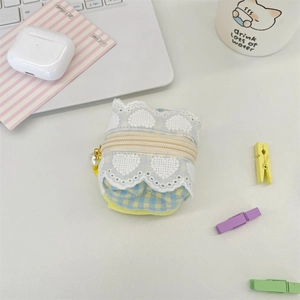 Detailed view of a cute blue and yellow checkered fabric earphone case with lace and pearl