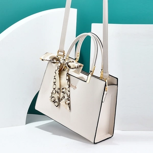 White litchi pattern top handle bag with gold hardware and elegant scarf detail