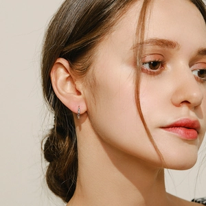 Elegant s925 silver hoop earrings with colorful zircon stones shown on a model