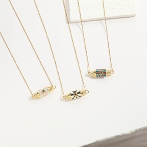 Enameled cylinder necklaces with bow zircon charms in macaron pink and black and white