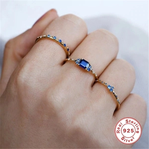 Three-piece S925 sterling silver gold-plated ring set with blue sapphires and cubic zirconia