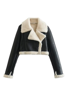 Detailed view of the textured PU leather and white faux shearling lining on the moto jacket