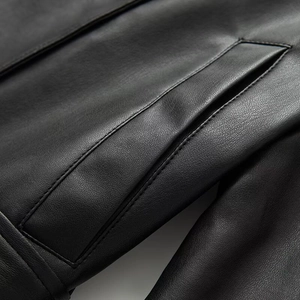 Women's faux leather short trench coat featuring detailed pocket and premium stitching