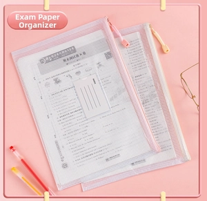 Close-up of pink and beige A4 mesh zipper file bags with index cards and nylon texture