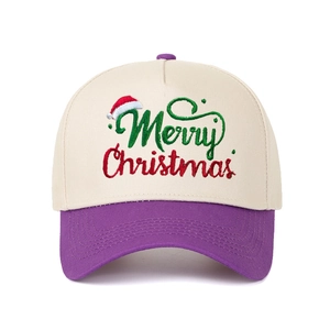 Detail of Merry Christmas embroidery on a two-tone baseball cap with a purple brim