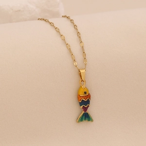Detailed close-up of a 3D colorful enamel fish pendant on a delicate gold chain necklace