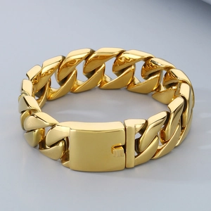 Detailed macro view of 20mm gold Cuban link bracelet with high-polish steel surface