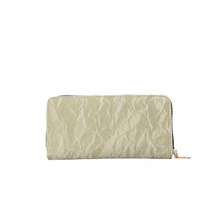Green long zip-around wallet for women featuring elegant pleated velvet-like texture
