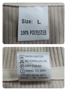 Detail view of the beige corduroy jacket size label and 100% polyester wash care tag