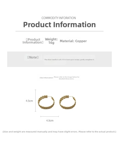 Detail showing copper hoop earrings with woven texture, 4.5cm height and silver needle posts