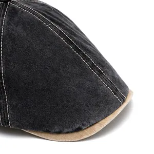 Washed grey vintage newsboy cap with foldable wide brim and contrast stitching