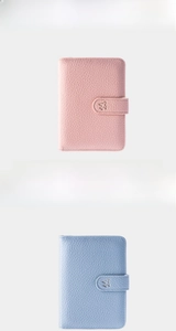 Litchi texture leather passport covers in pink and blue with small airplane metal buckle