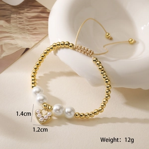 Detail showing gold beaded heart pendant bracelet with dimensions 1.4cm and weight 12g