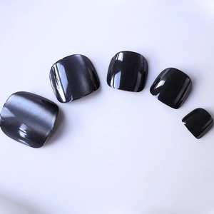 Short square black cat-eye false toenails with shimmering magnetic silver beam finish