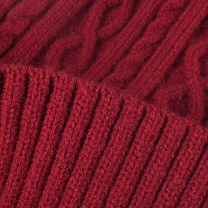 Winter dark red cable knit beanie with fleece lining and warm ribbed texture