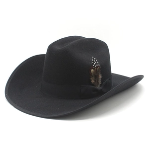 Close-up of black felt cowboy hat featuring delicate side feathers and a satin band