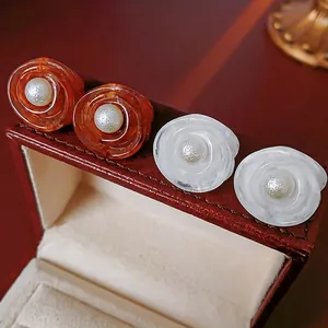 French vintage flower pearl earrings in amber orange and marble white floral resin