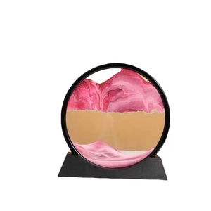 Quadro di sabbia mobile rotondo rosa e oro con cornice nera e base trapezoidale